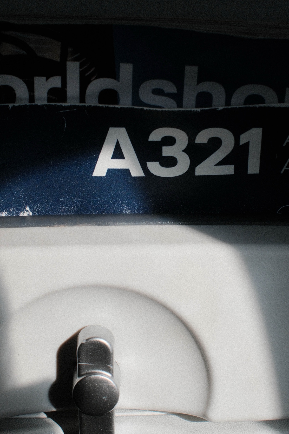 A close view of an aircraft marked A321 at the gate