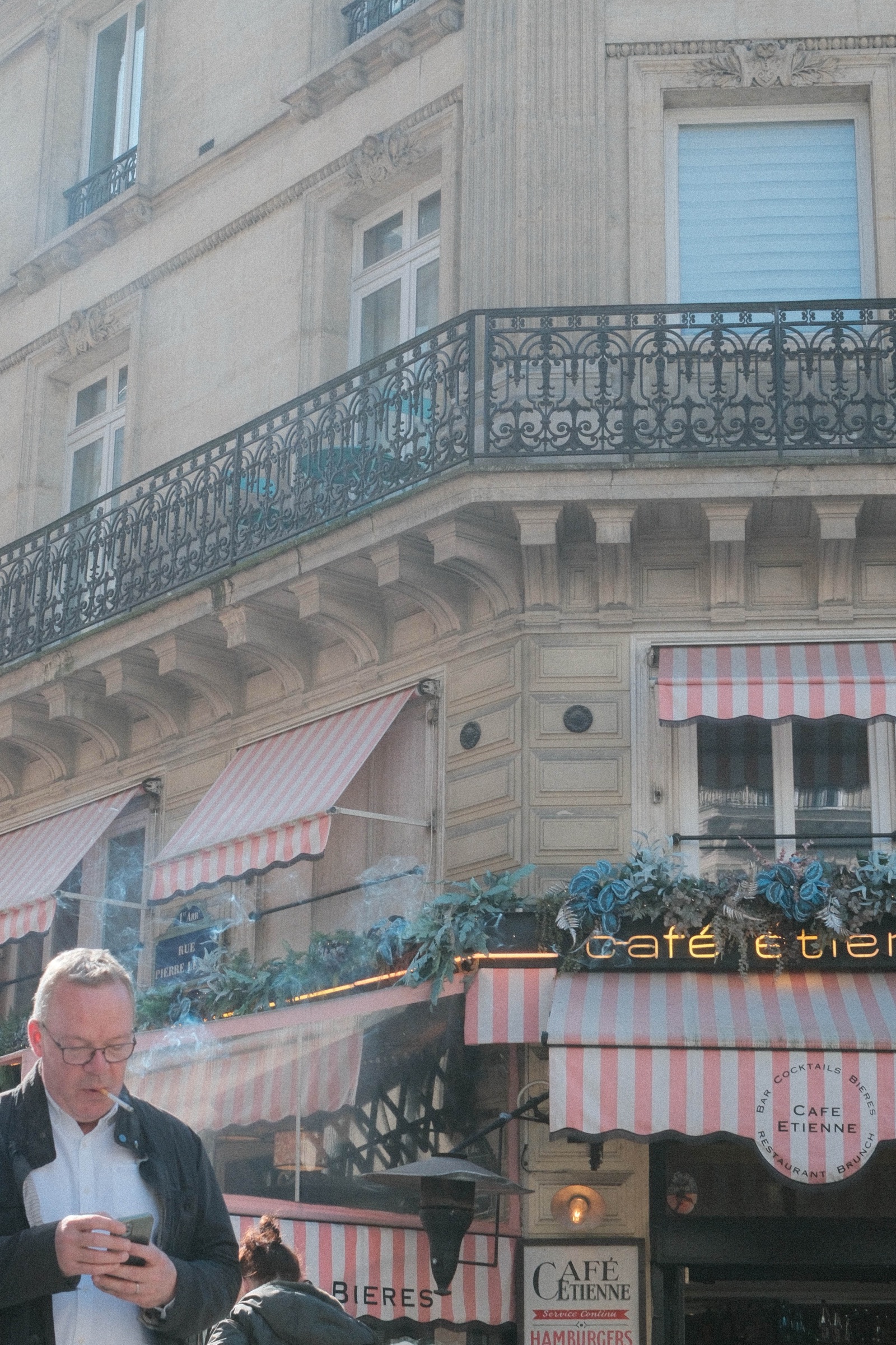 A quiet café street seen through soft afternoon light