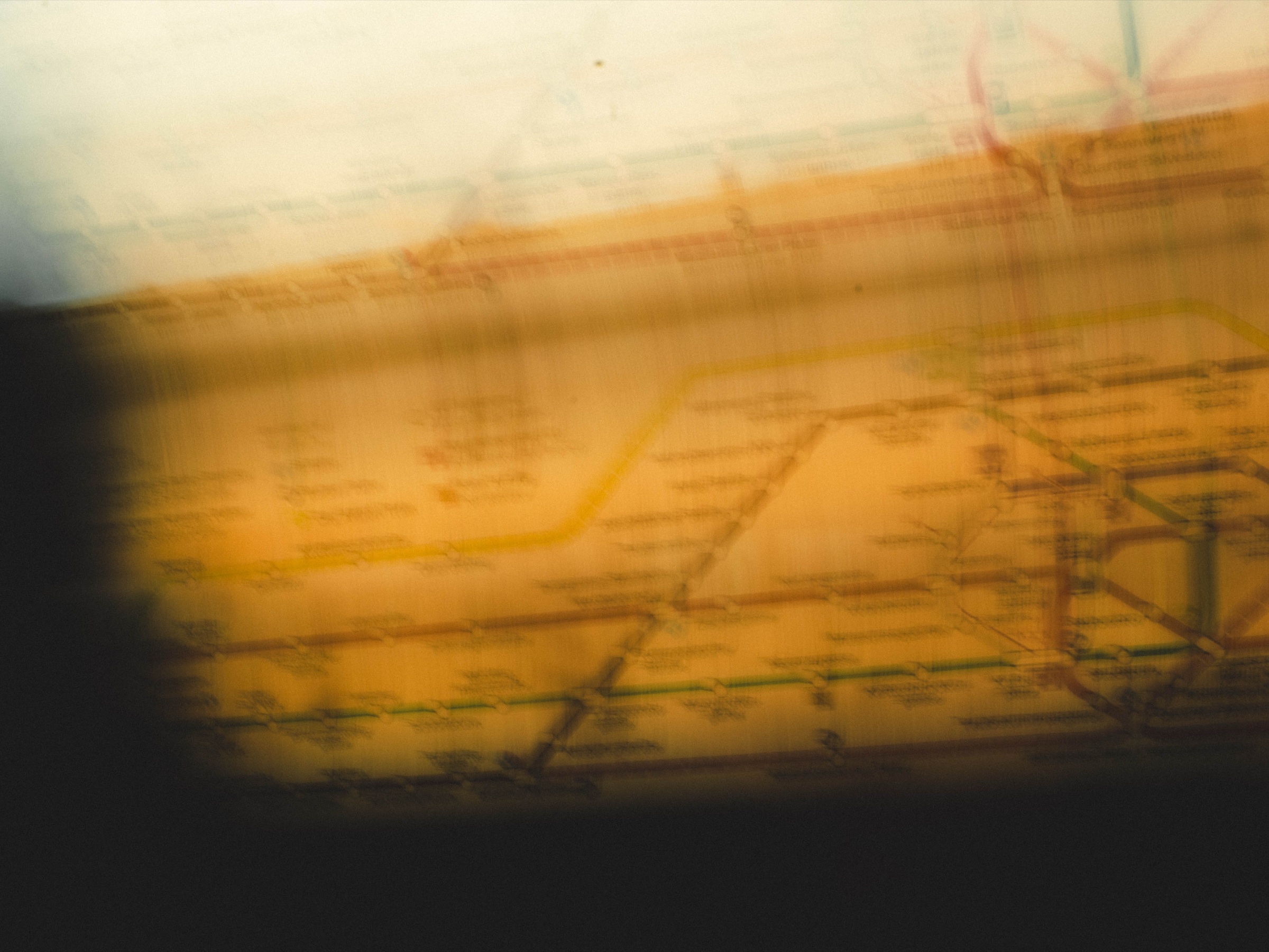 Airport runway markings blurred by movement and warm light